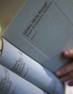 The owner of a book shop looks through a copy of the book 'Hitler, Mein Kampf A Critical Edition' A critical edition' in Munich
